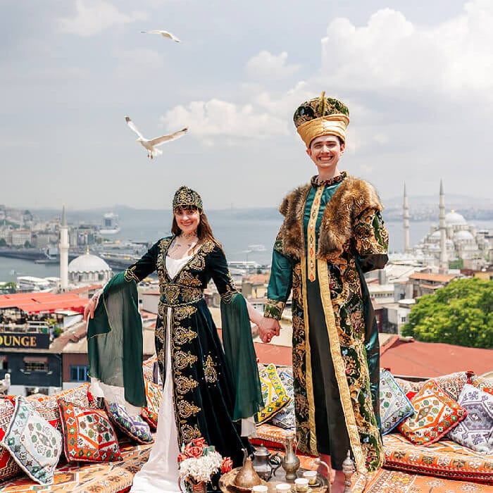 Tourist-posing-in-sultan-dress-on-rooftop.jpg